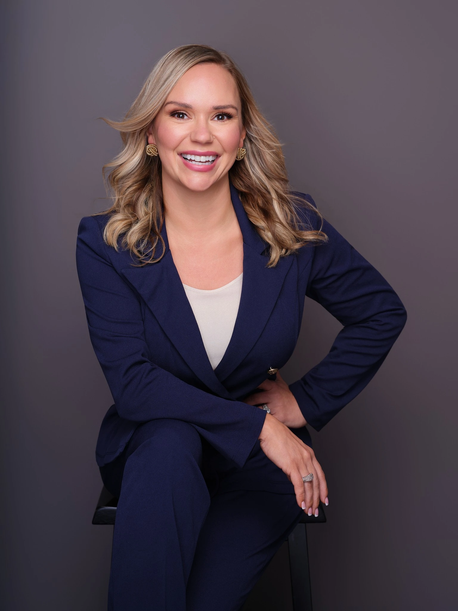 Ashlee Morris seated in a navy blazer